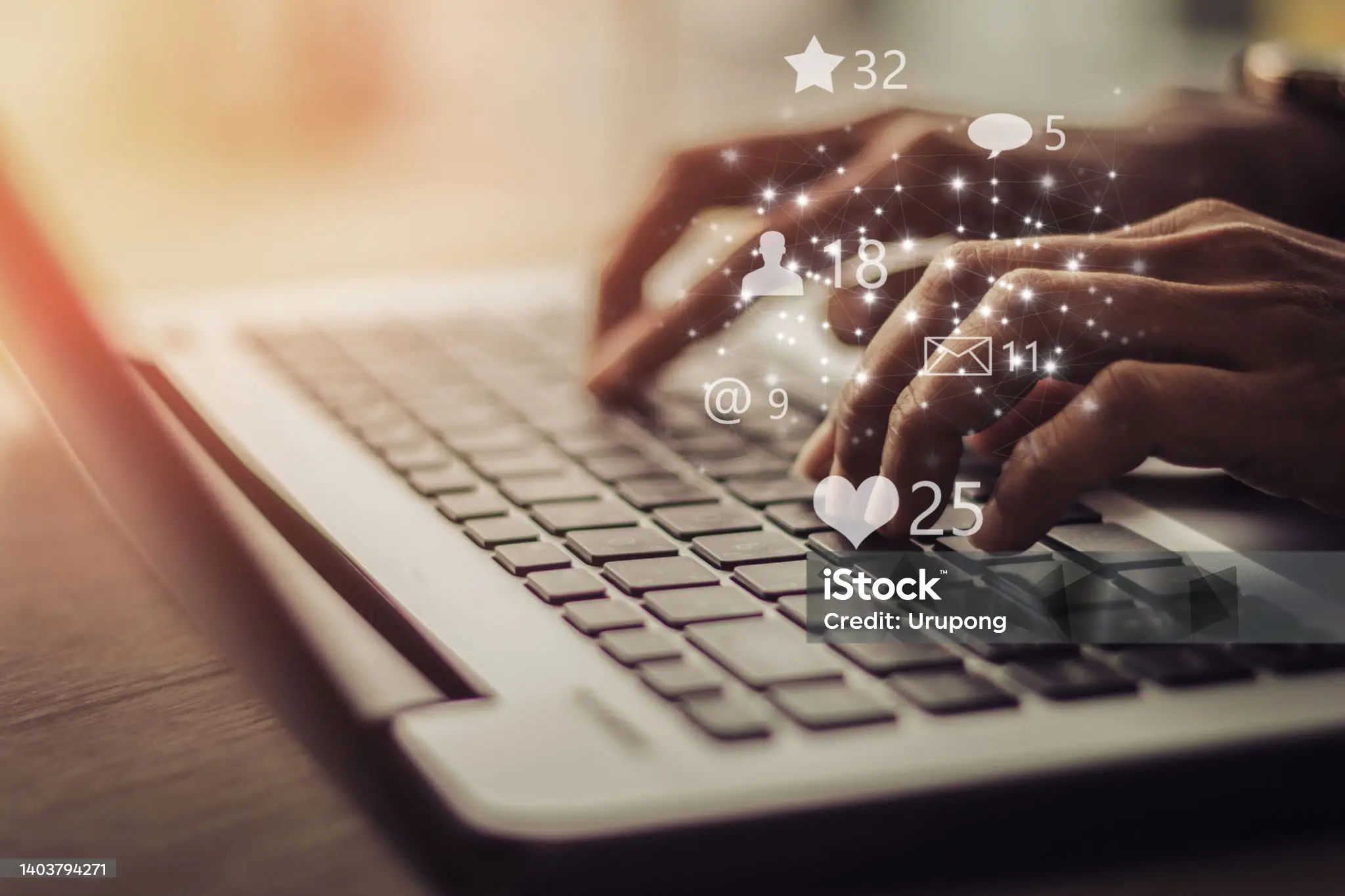 The image depicts a person typing on a laptop keyboard, surrounded by various social media icons and numbers. * **Laptop Keyboard** * The laptop keyboard is white with black keys. * It has a standard QWERTY layout. * The user's hands are positioned on the keyboard, with their fingers hovering over the keys as if they are about to type. * **Social Media Icons and Numbers** * There are several social media icons scattered throughout the image, including a heart, a star, an envelope, and a speech bubble. * Each icon is accompanied by a number, which appears to represent the number of likes or comments on a particular post. * The numbers range from 2 to 32, suggesting that the user has received a significant amount of engagement on their social media posts. * **Background** * The background of the image is blurred and out of focus. * It appears to be a room with white walls and a window, but the details are not clear due to the blurriness. Overall, the image suggests that the user is actively engaged in social media and is receiving a lot of attention on their posts. The presence of various icons and numbers implies that the user is tracking their online activity and trying to maximize their reach and engagement.