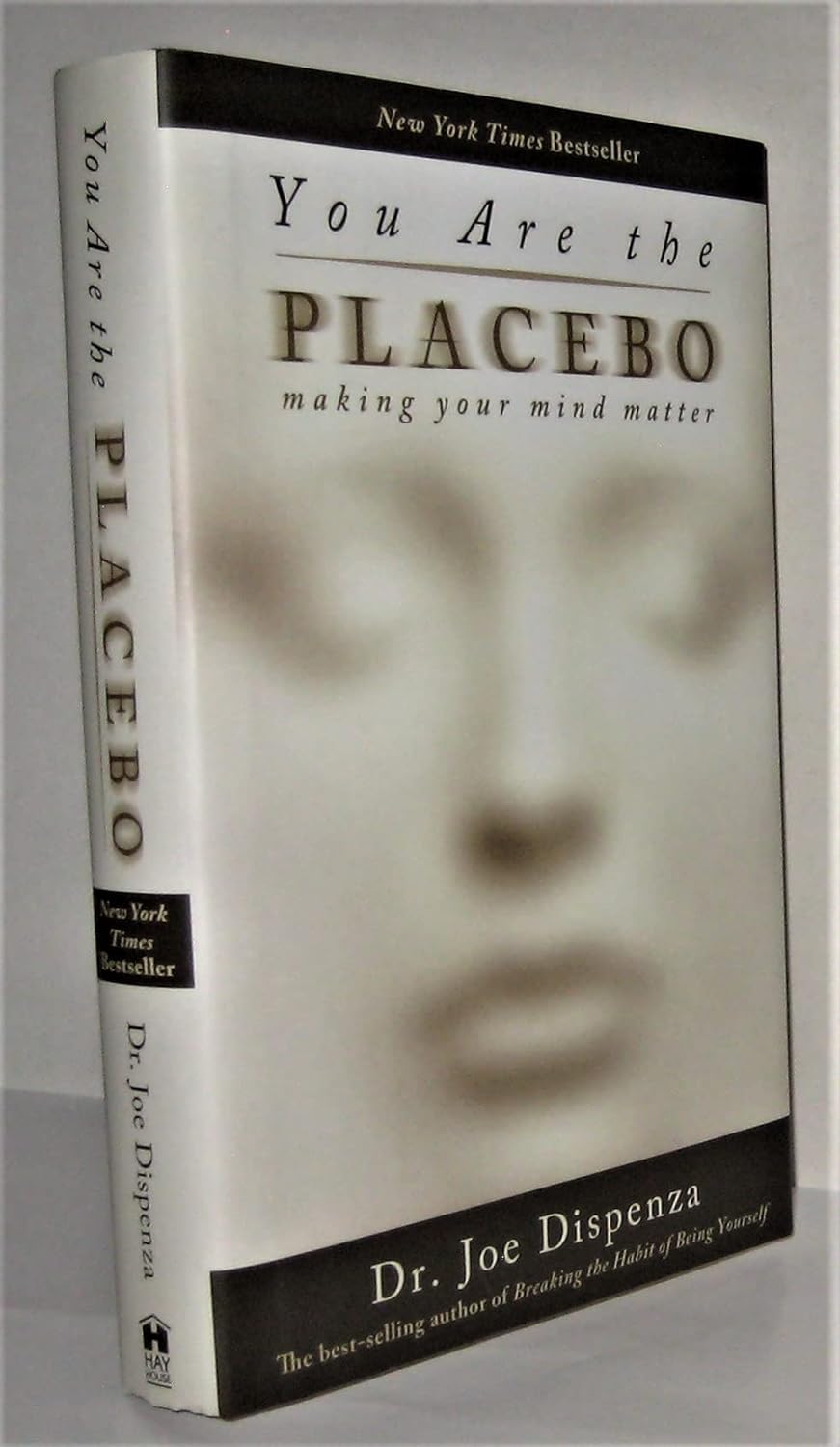 Book cover of "You Are the Placebo: Making Your Mind Matter" by Dr. Joe Dispenza, featuring a minimalist design with a blurred face and the title prominently displayed.